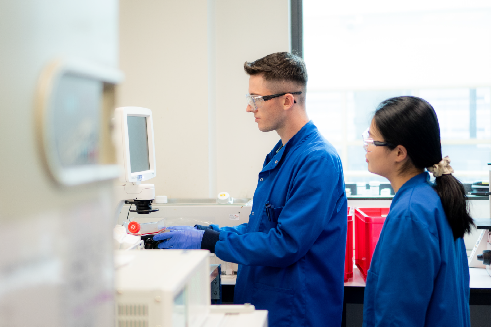 Two QUB students working in a medical research lab